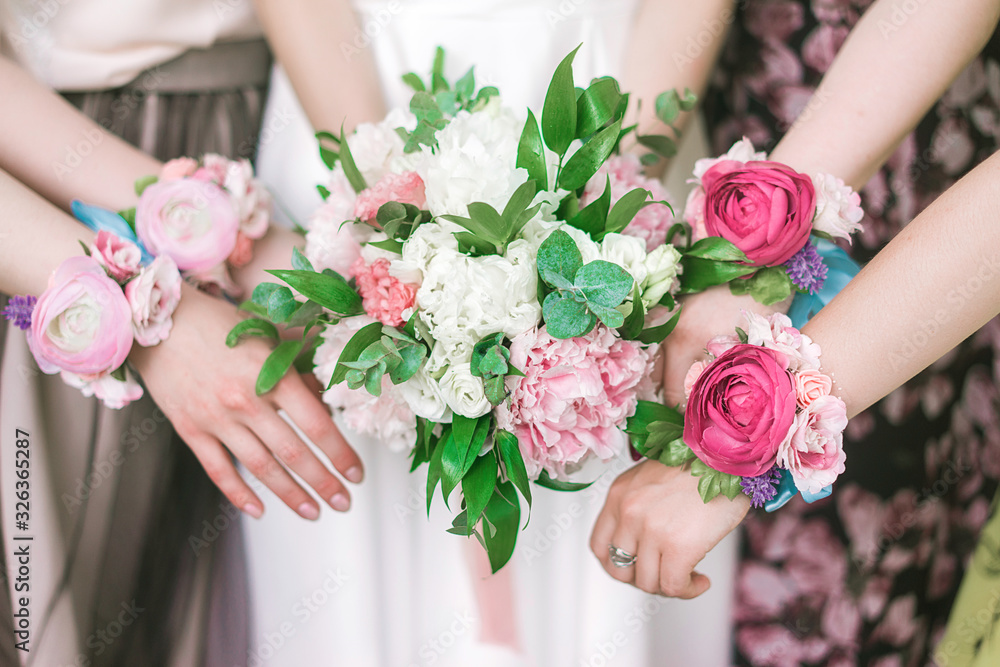 Bouquet of the bride and bridesmaids on hand miona and pink flowers. Bouquet of the bride and bridesmaids on hand miona and pink flowers.