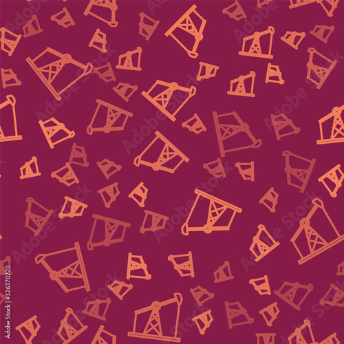 Brown line Oil pump or pump jack icon isolated seamless pattern on red background. Oil rig. Vector Illustration