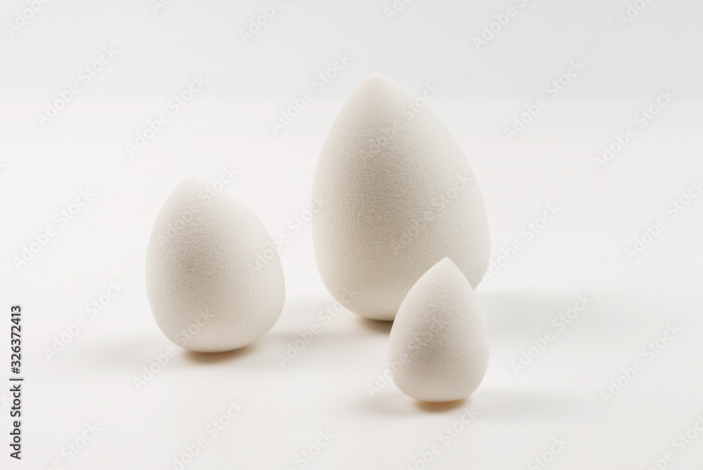 Small, medium and large white beauty blender isolated. Small, medium and large white beauty blender isolated.