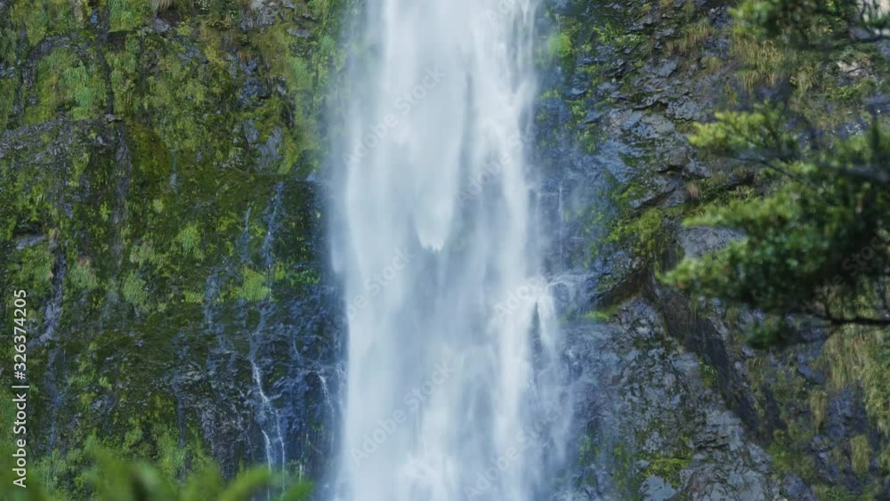 Devils Punchbowl Waterfall of Arthur's Pass in New Zealand; water falling down rapidly; beautiful natural waterscape Devils Punchbowl Waterfall of Arthur's Pass in New Zealand; water falling down rapidly; beautiful natural waterscape
