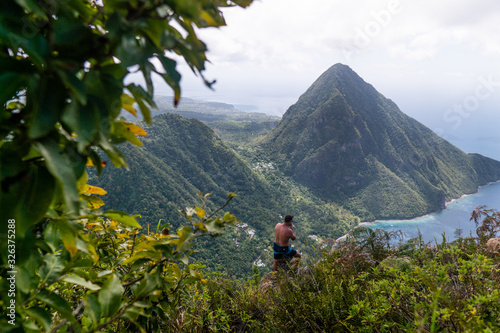 man enjoying view from mountain