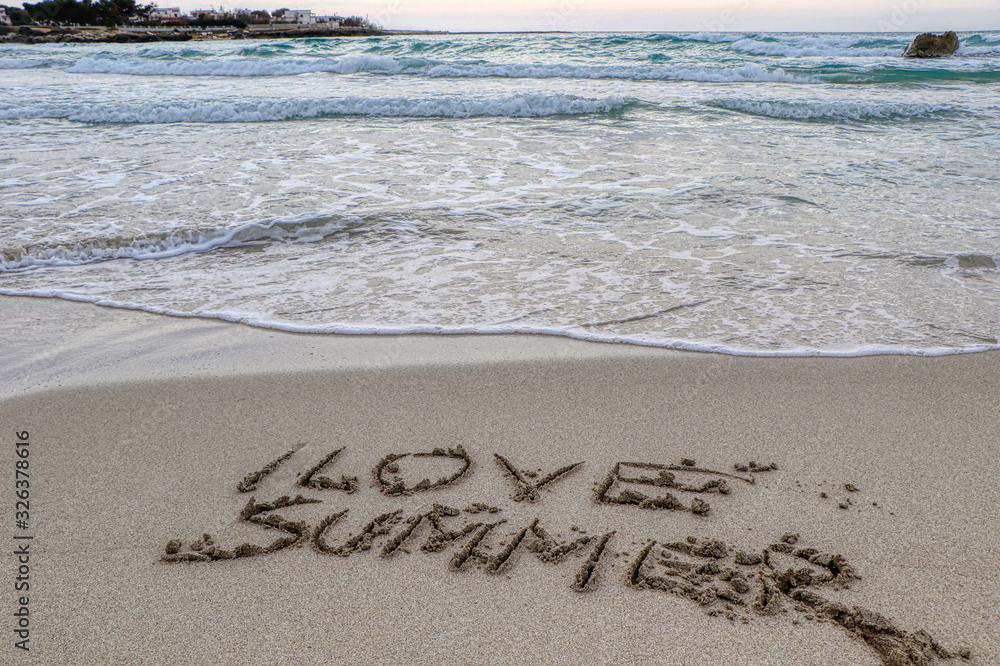 Fototapeta premium I love summer written on the sand in a beach in the middle of winter on the coast of Taranto, Puglia, Italy