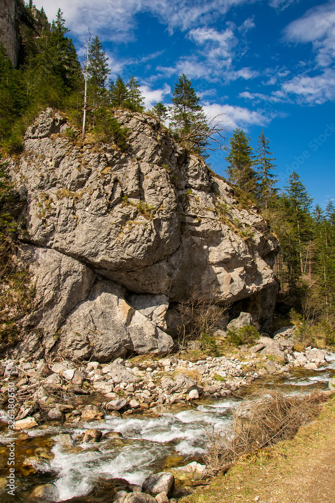 Rapid creek and rocks on the way to famous Chocholowska Clearing, Tatra Mountains, Poland Rapid creek and rocks on the way to famous Chocholowska Clearing, Tatra Mountains, Poland