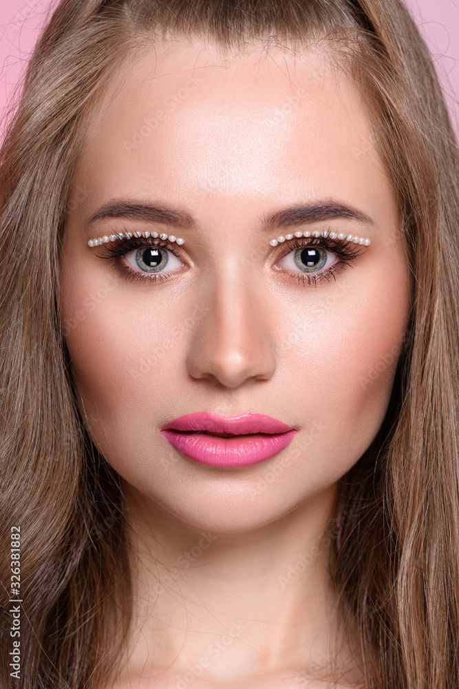 Beautiful girl with pearls make-up, pink lips. Beautiful girl with pearls make-up, pink lips.