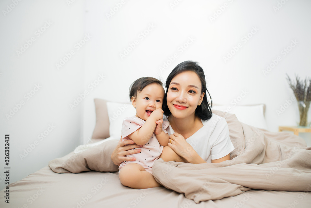 Beatuful mother playing with daughter. Little girl have fun at home. Beatuful mother playing with daughter. Little girl have fun at home.