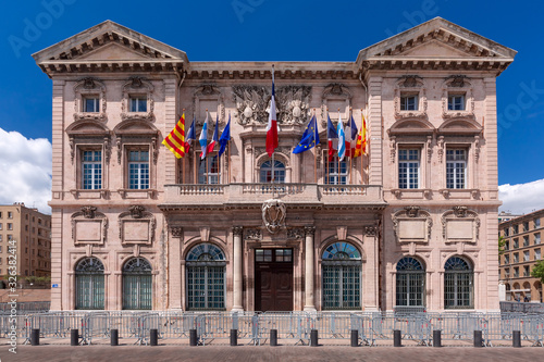 Beautiful baroque building of Marseille City Hall, Hotel de Ville, in old Vieux Port, Marseilles on sunny day, France photo