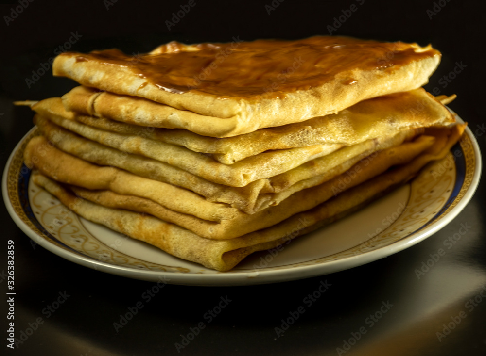 Homemade pancakes, milk pancakes on a plate. Homemade pancakes, milk pancakes on a plate.