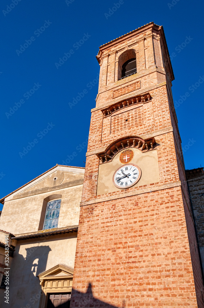 Bettona, village in Umbria of Etruscan origins, Italy. Close to Assisi, it rises on the Martani mountains on the banks of the Tiber river. Facade and bell tower of the Church of 