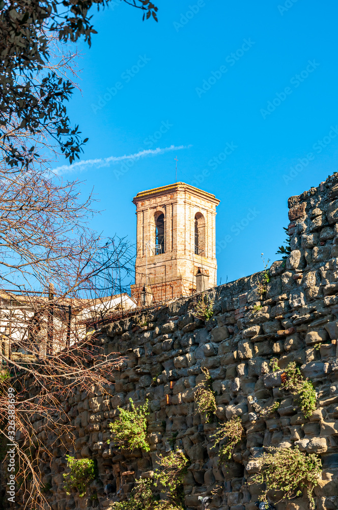 Bettona, village in Umbria of Etruscan origins, Italy. Close to Assisi, it rises on the banks of the Tiber river. View of the bell tower of the Church of 