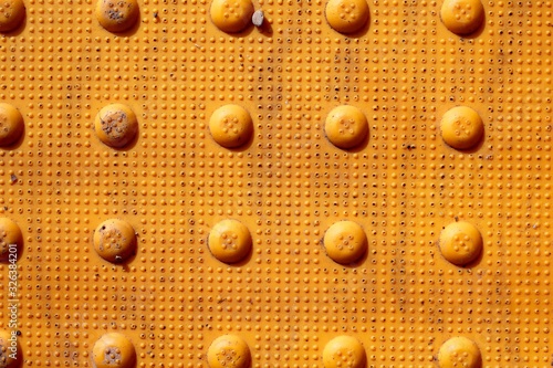 A close view of the bright yellow pointed mat.