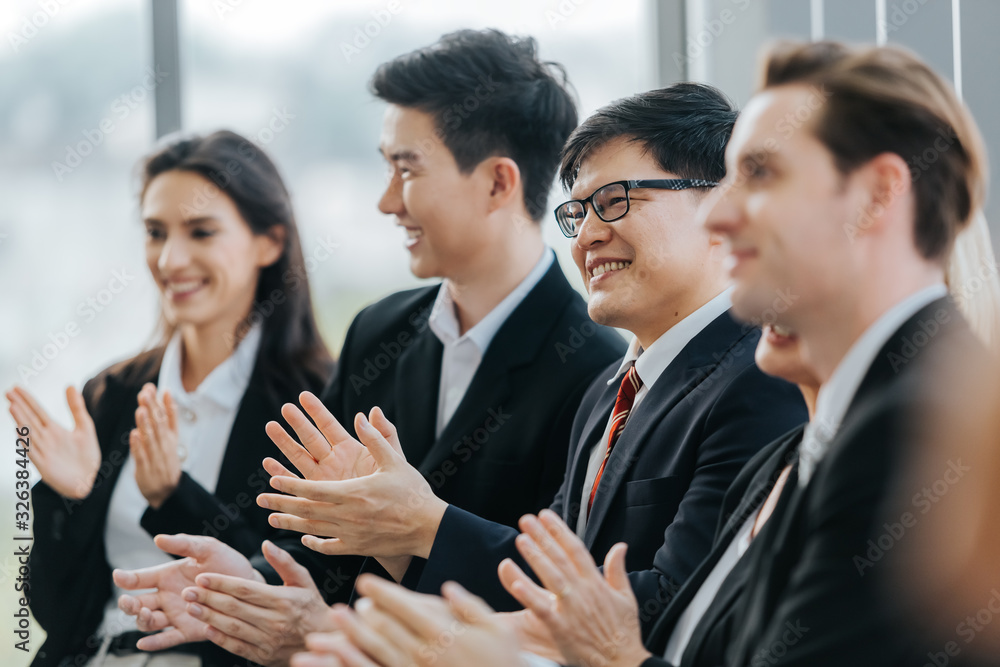 Business people sitting applauding speaker succesful at meeting. Business people sitting applauding speaker succesful at meeting.