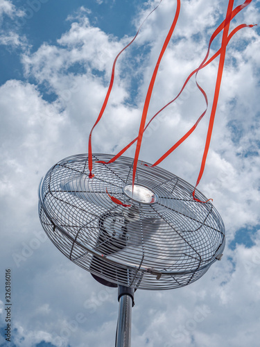 electric fan close up with red ribbons