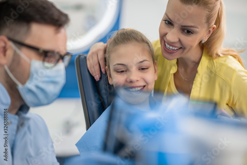 Dentist explaining x ray picture to patient