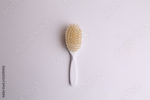 white hairbrush in color background