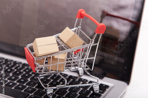 Small shopping cart and express box on the dollar