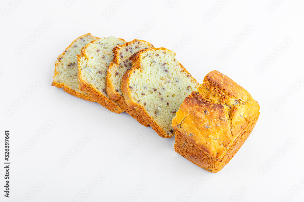 Sliced loaf of whole-grain bread on white background. Freshly baked homemade square bread. Organic and vegetarian food concept. Copy space for text, close up Sliced loaf of whole-grain bread on white background. Freshly baked homemade square bread. Organic and vegetarian food concept. Copy space for text, close up