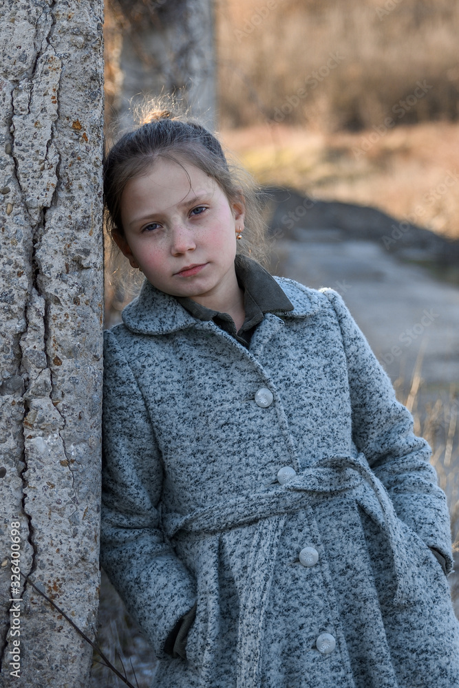 Portrait of a little, young cute smiling girl, close-up.Outdoor Portrait of a little, young cute smiling girl, close-up.Outdoor