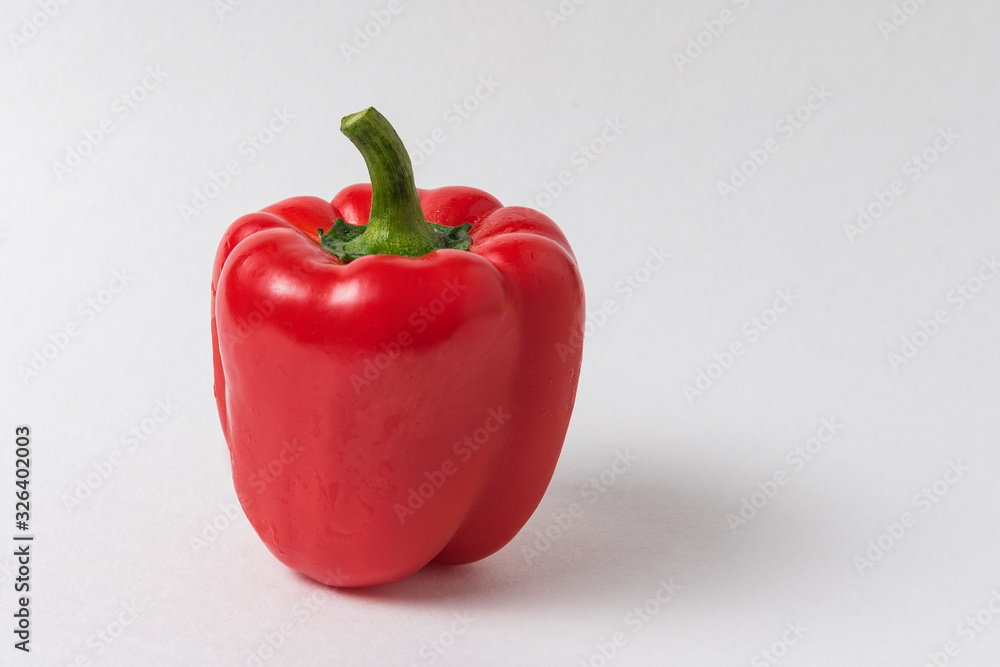 Raw red sweet pepper on white background. Fresh vegetables Raw red sweet pepper on white background. Fresh vegetables