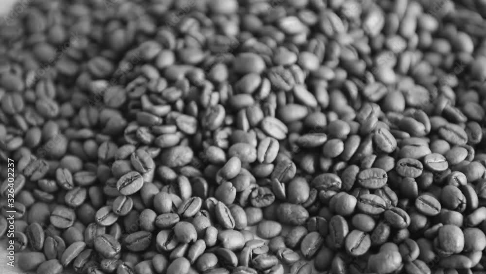 coffee beans are mixed with a wooden spatula coffee beans are mixed with a wooden spatula