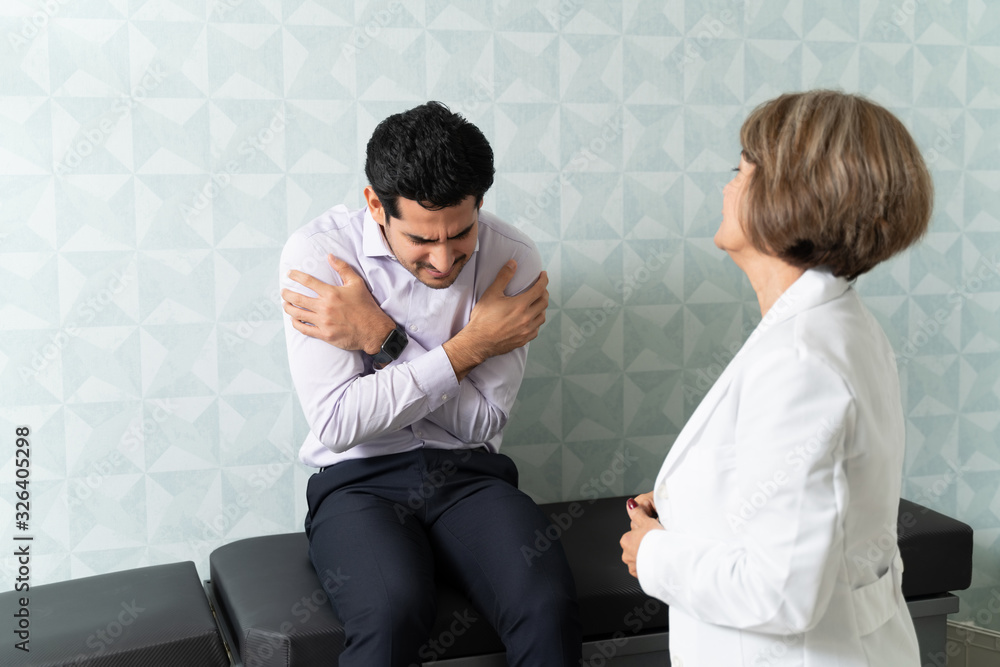 Physician Examining Patient Trembling Due To Fever Physician Examining Patient Trembling Due To Fever