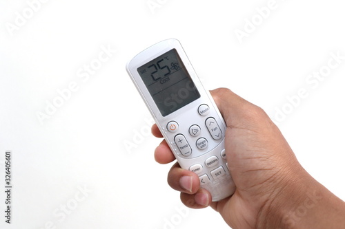 Wallpaper Mural Air conditioner remote in hand  white background Torontodigital.ca