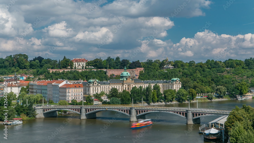 view of the manes bridge with a building of the czech parliament behind it timelapse from Old Town Bridge Tower.