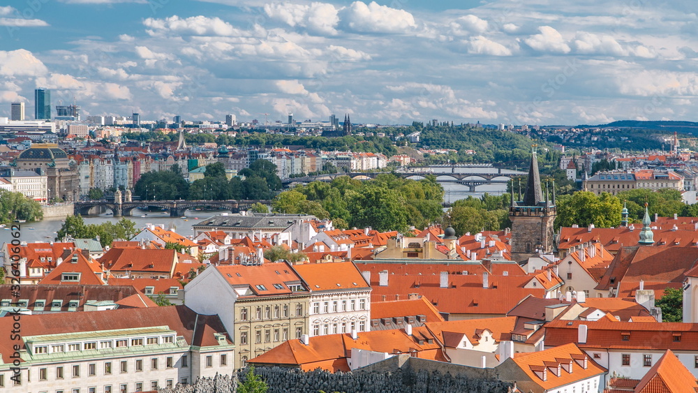 Panorama of Prague Old Town with red roofs timelapse, famous bridges and Vltava river, Czech Republic.