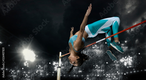 Woman in action of high jump. Sports banner © Andrey Burmakin