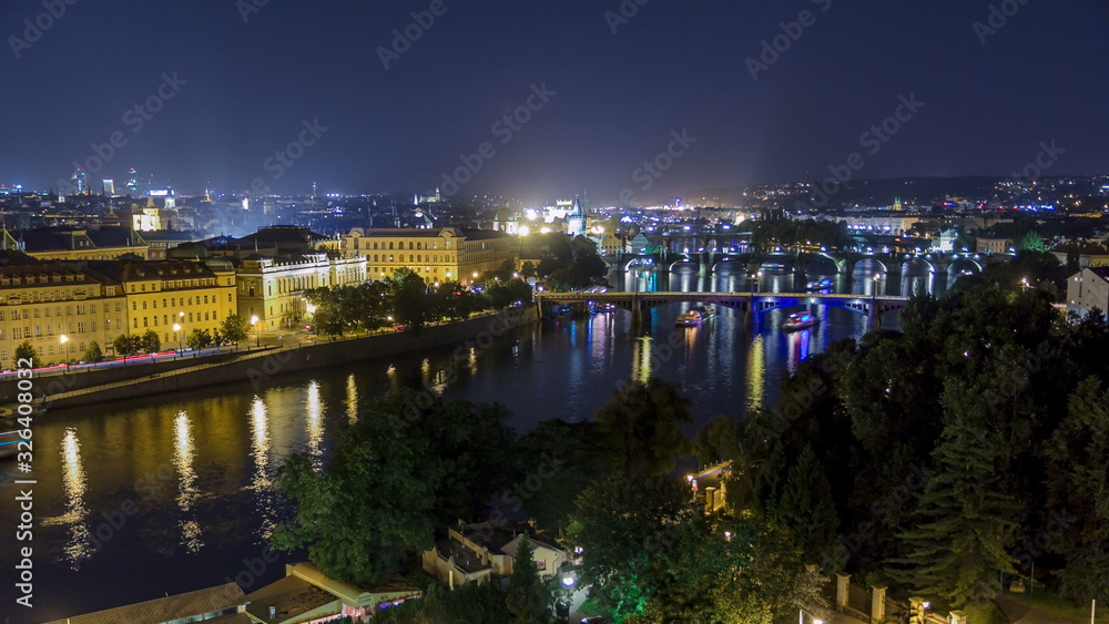 Scenic view of bridges on the Vltava river night timelapse and of the historical center of Prague: buildings