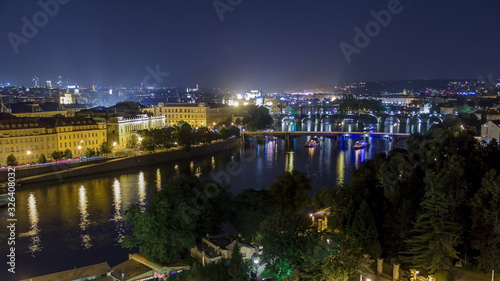 Scenic view of bridges on the Vltava river night timelapse and of the historical center of Prague: buildings