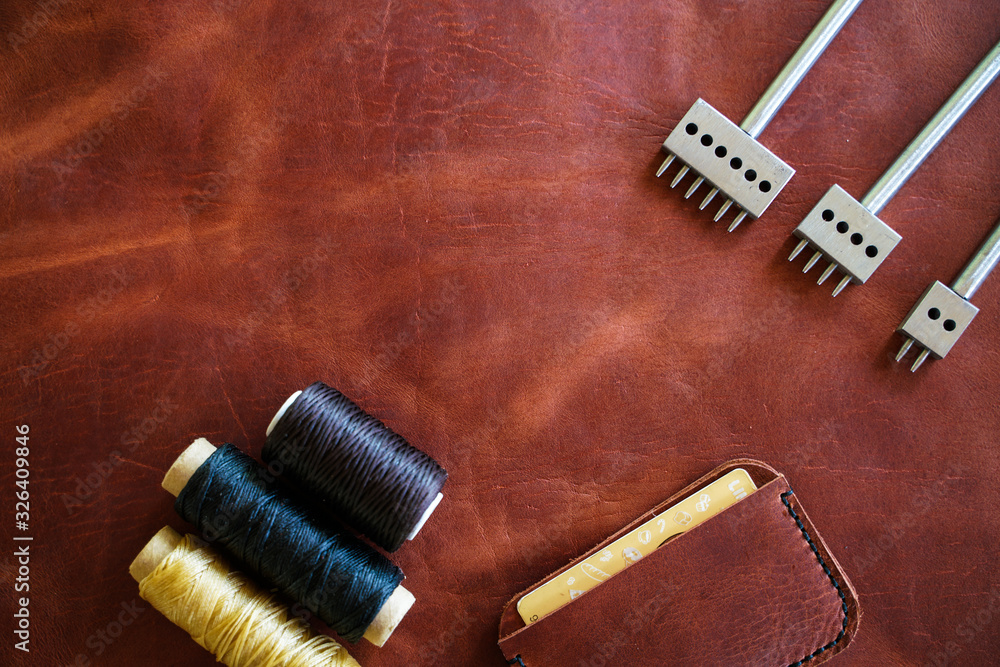 Leather card wallet handmade with thread and leather tool object Leather card wallet handmade with thread and leather tool object