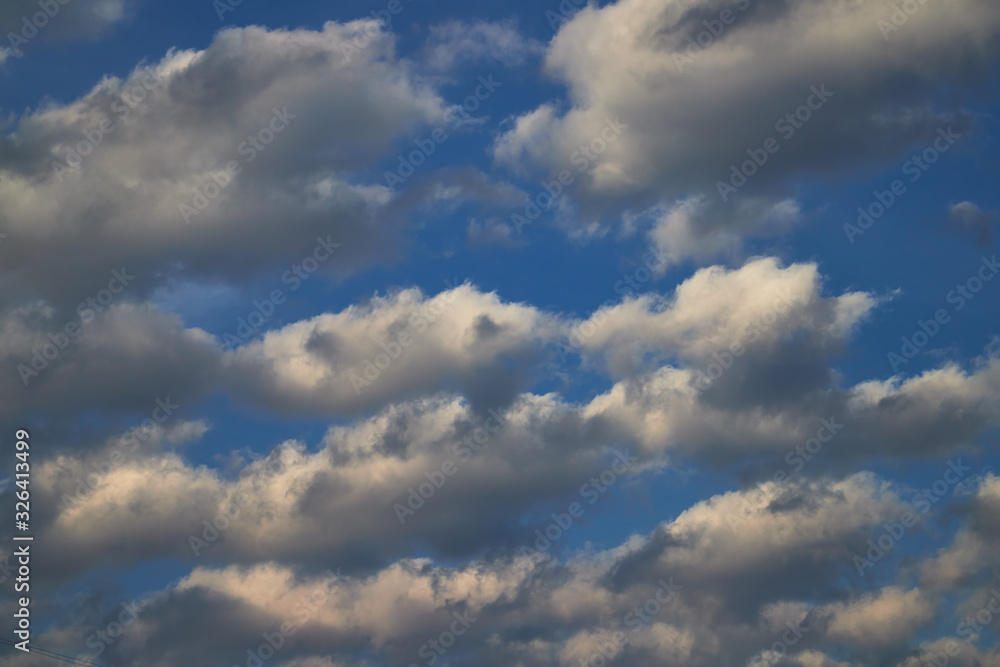 Beautiful, spring clouds in the blue sky, which portend the change of weather. Beautiful, spring clouds in the blue sky, which portend the change of weather.