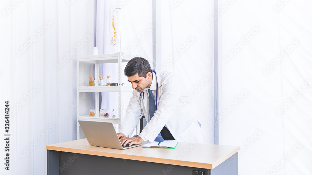 Asian doctor in gown uniform working in seriously at hospital or medical clinic Asian doctor in gown uniform working in seriously at hospital or medical clinic