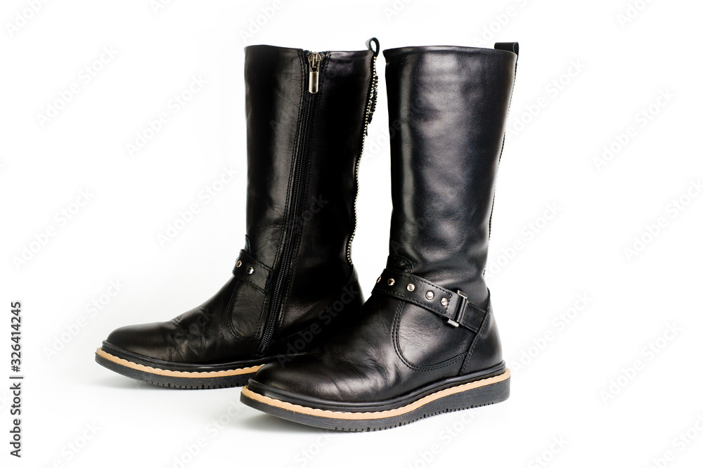 Black leather women?s boots fastened with a zipper. Background for shoes.
