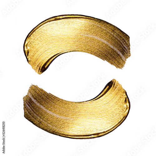 Creative brushstrokes of gold paint isolated on a white background. Gold paint texture.Acrylic gold paint. Smears of cosmetics, blush, highlighter, eye shadow, lipstick.