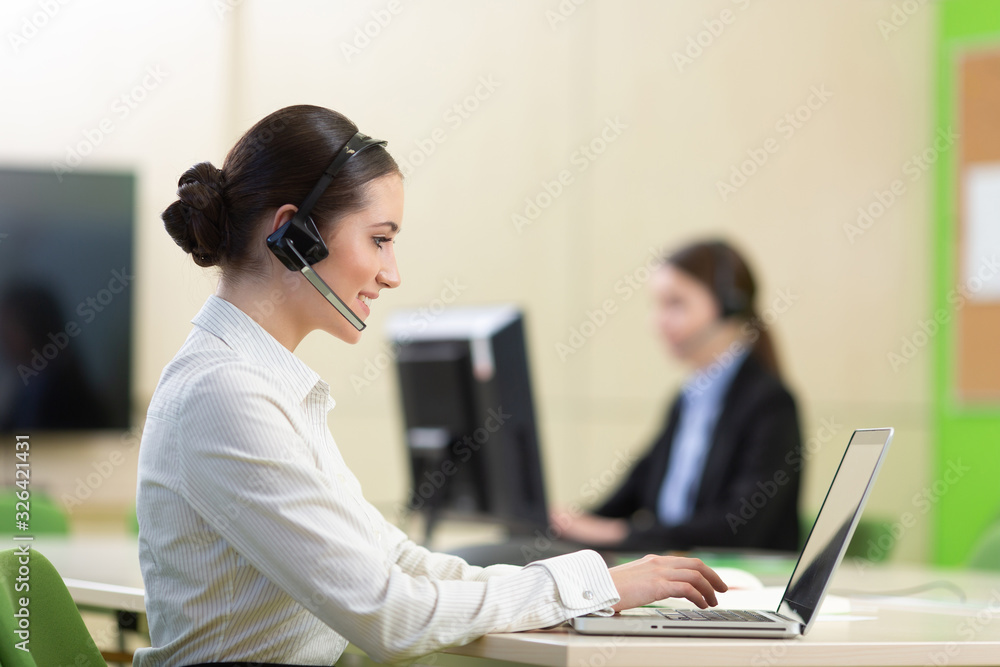 Young beautiful business woman with headset. Call center Young beautiful business woman with headset. Call center