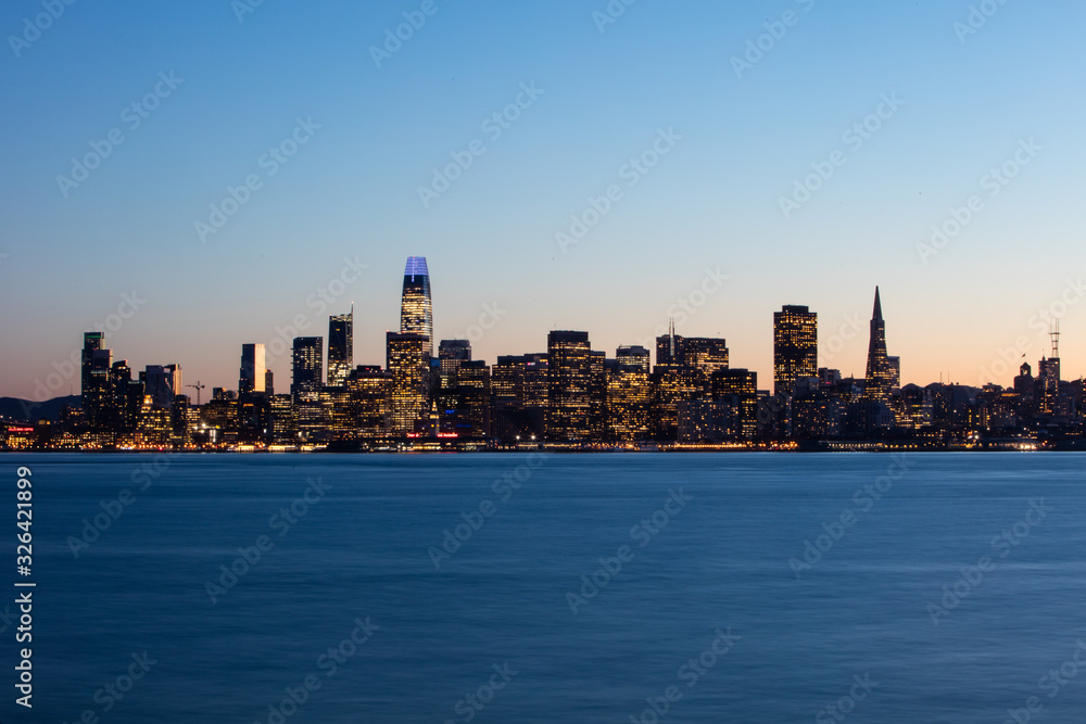 A tranquil twilight settles over the beautiful city of San Francisco in California. This west coast urban area, including Oakland and San Jose, is home to about 8 million people.