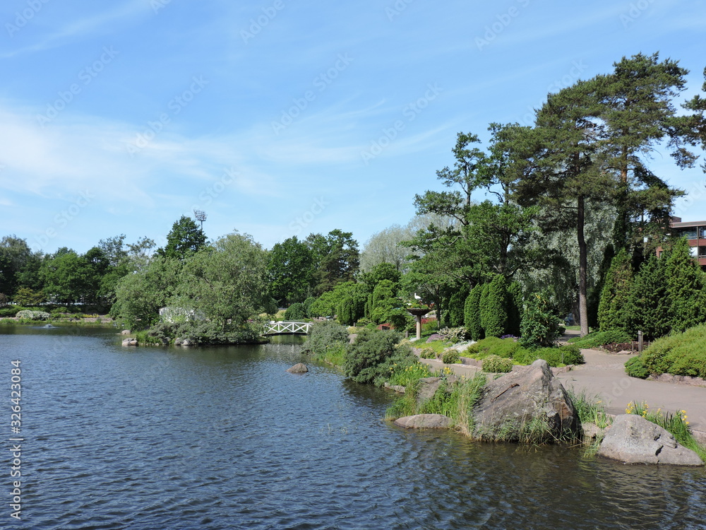 landscape with pond and trees in Kotka, Finland