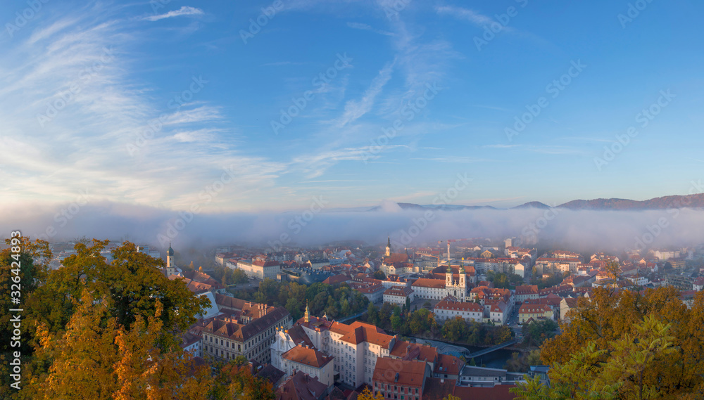Cityscape of Graz from Shlossberg hill, Graz, Styria region, Austria, in autumn. Panoramic view.