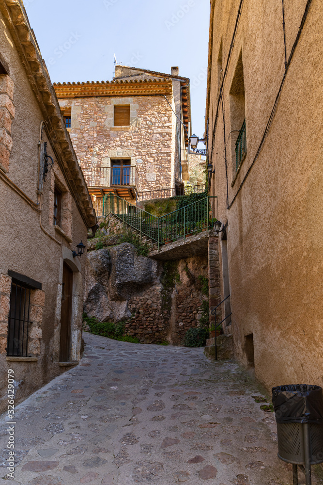 View of one of the streets that goes up to the high historical center of Mura, Catalonia, Spain