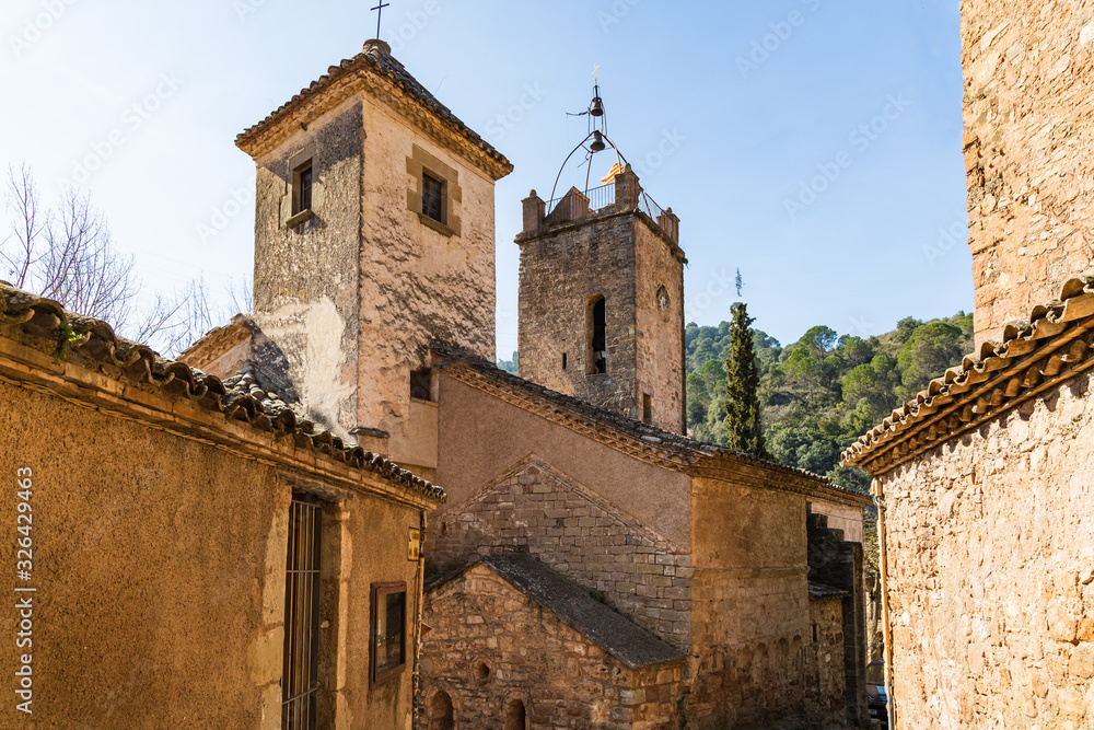 View of the two towers of the St. Marti church in Mura, one of them contains the bell tower, Catalonia, Spain