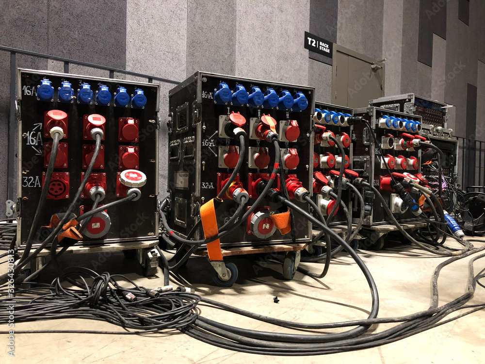Electric power distribution boxes with power and signal cables.  Installation of professional equipment for a concert. Stock Photo | Adobe  Stock