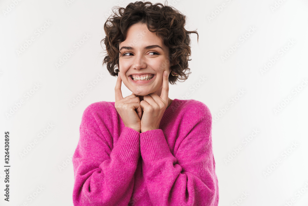 Image of happy woman smiling and pointing finger at her cheeks - obrazy, fototapety, plakaty 