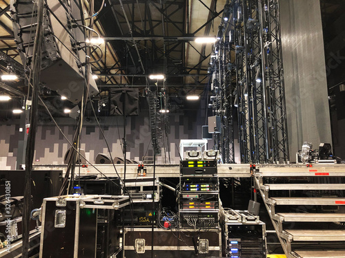 Fototapeta Installation of professional sound, light, video and stage equipment for a concert
