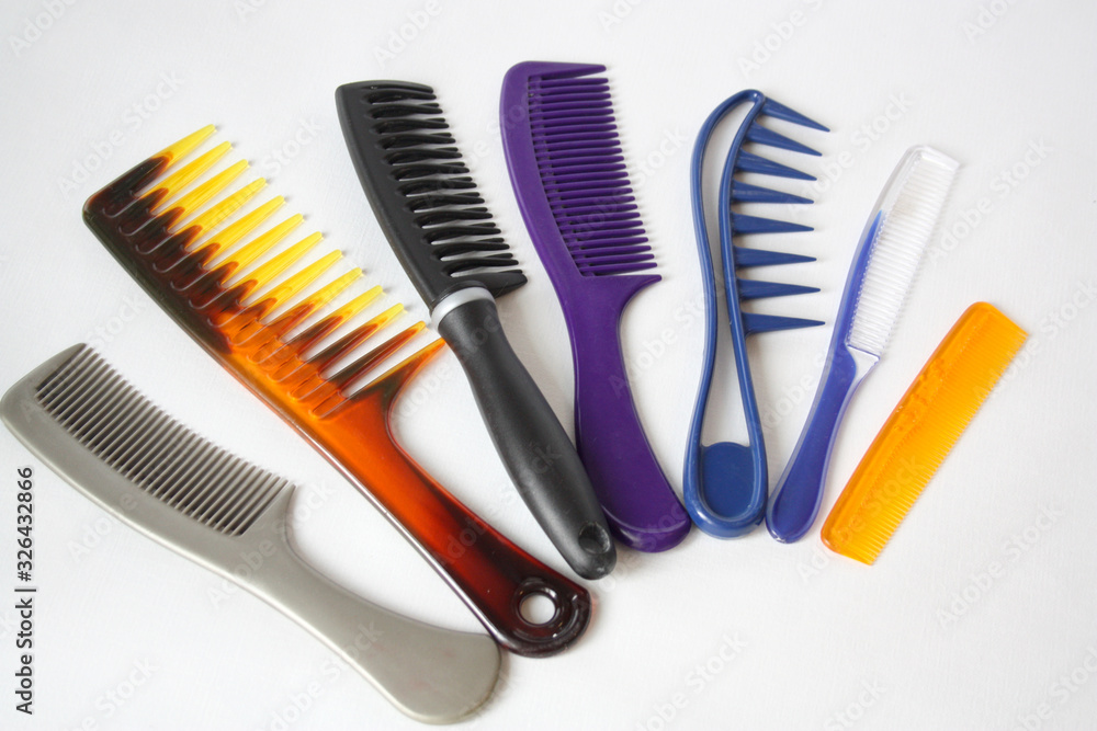 A set of plastic hair combs. White background. A set of plastic hair combs. White background.