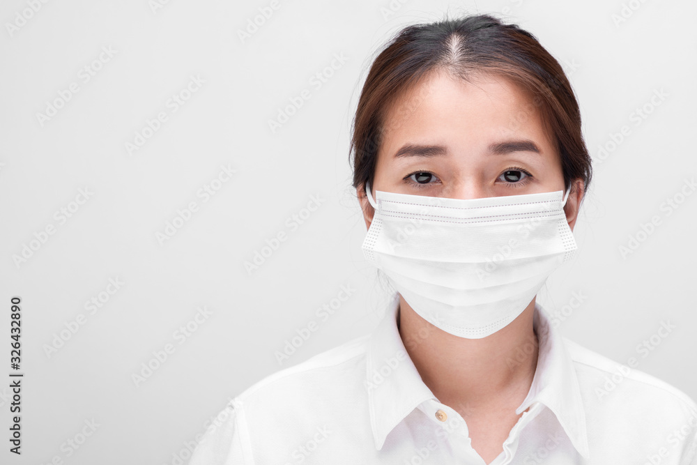 Young woman with face mask isolated on white background to prevent coronavirus & PM 2.5 air pollution, Woman demonstrate how to wear virus protective face mask. Young woman with face mask isolated on white background to prevent coronavirus & PM 2.5 air pollution, Woman demonstrate how to wear virus protective face mask.