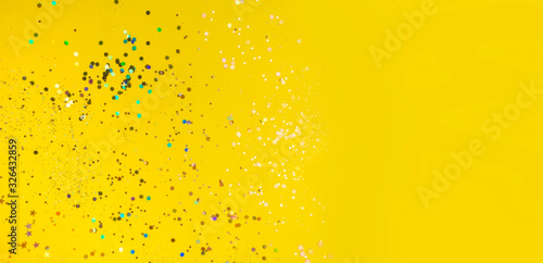 yellow background with colorful confetti