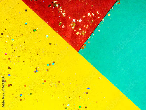 yellow red green cardboards background with glitters