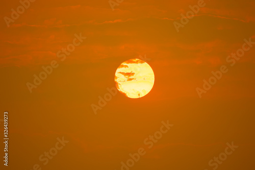 Big red sun and drark cloudns on summer season on sky and cloud photo