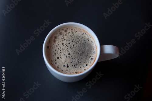 coffee with milk on black background